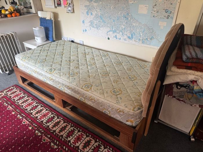 Wooden single bed with drawers