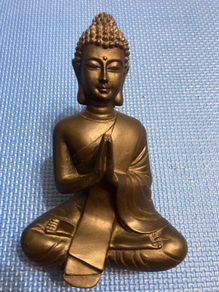 Solid wood black Buddha figurine in a meditative pose Statue