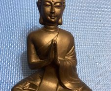 Solid wood black Buddha figurine in a meditative pose Statue
