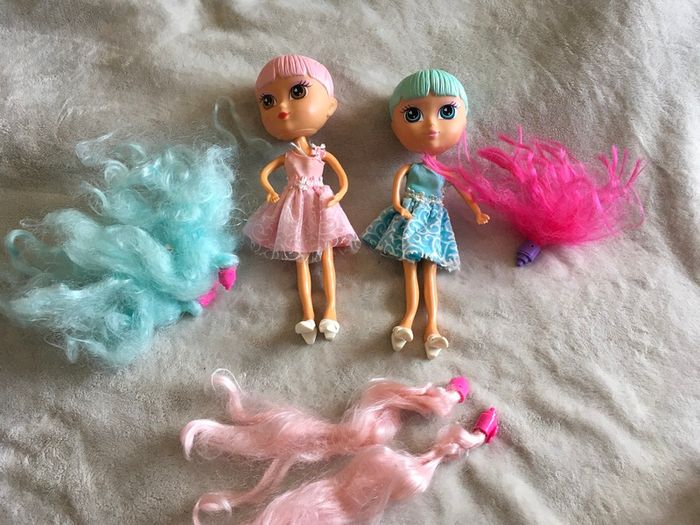 Dolls with removable hairs