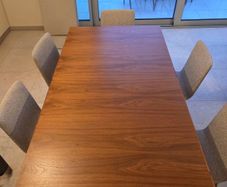 Dining table & 6 chairs - L175cm x W100cm extendable to 275cm. Brushed stainless steel central base with 6 Skovby Walnut chairs. Perfect condition. Downsizing.
