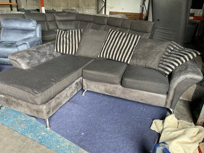 grey/black corner sofa with scatter cushions
