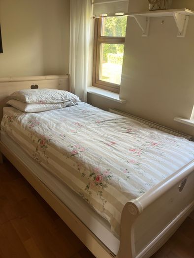 Beautiful cream single sleigh bed. Mattress included.