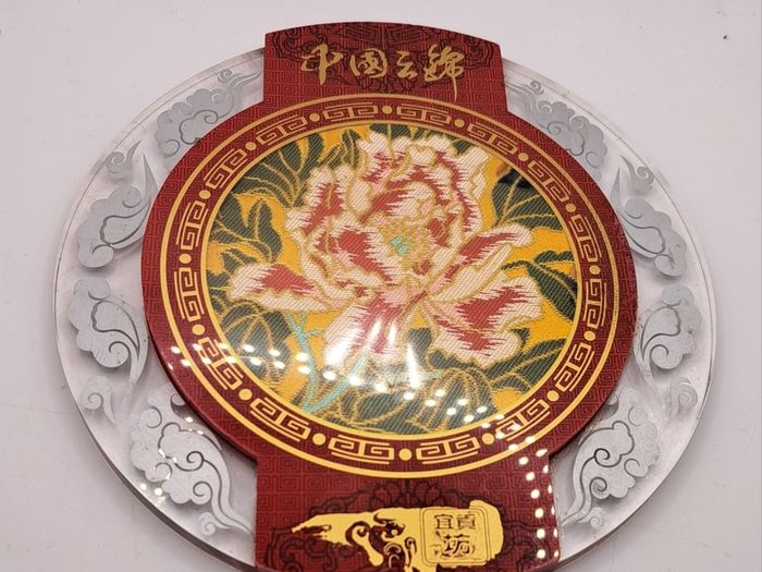 Vintage Chinese fabric in a glass plate