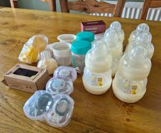 Newborn bottles, soothers, pump parts