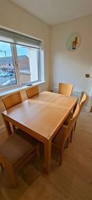 Extending kitchen table and six chairs