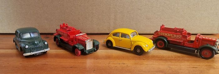 4 vintage toy cars -