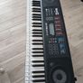 keyboard: never used, with charger and earphones stand Image 2