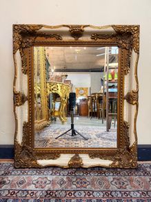 Parcel Gilt and Painted Bevelled Glass Mirror