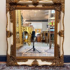 Parcel Gilt and Painted Bevelled Glass Mirror