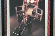 Framed Motivational Dedication Photo showing ambulance crew loading patient into rear of ambulance.