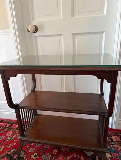 Mahogany table with glass top.