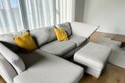 Grey corner sofa with matching footstool