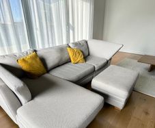 Grey corner sofa with matching footstool