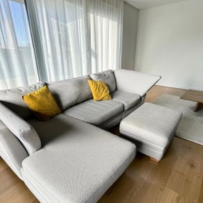 Grey corner sofa with matching footstool