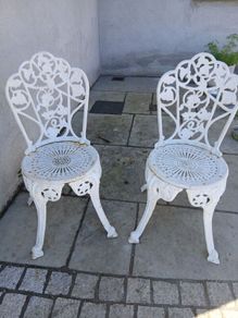 2 cast iron chairs