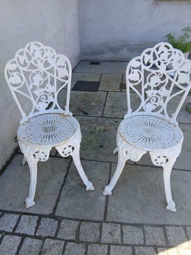 2 cast iron chairs