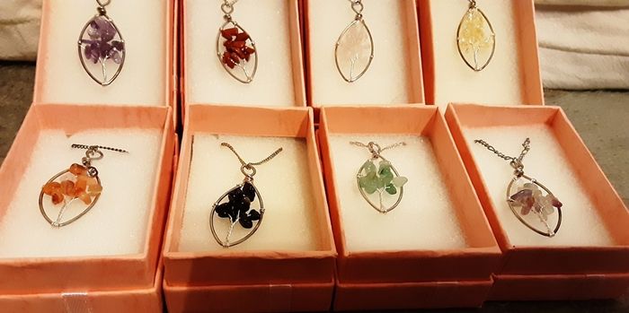 selection of homemade white metal necklaces