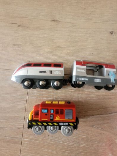 wooden train play set with two electric locomotives and lots of parts
