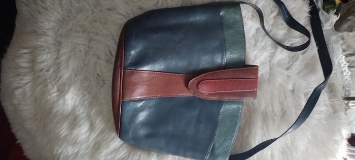 Leather bags one large red long handles tote or shoulde and one smaller shoulder Bag. Shoulder is 15r leather