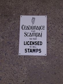 Irish antique style Enamel and Metal Sign. Licensed to Sell Stamps