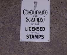 Irish antique style Enamel and Metal Sign. Licensed to Sell Stamps