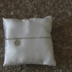 Silver bracelet with rudder