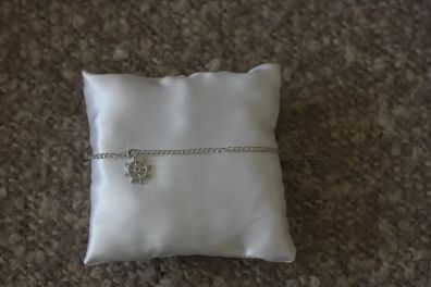 Silver bracelet with rudder