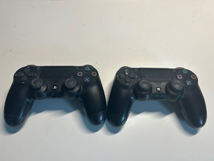 PlayStation 4 with 2 controllers, preloaded games and original box