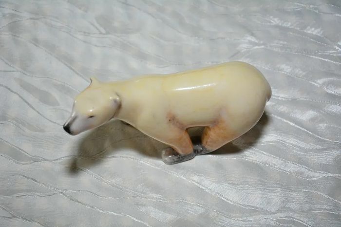 Stone sculpture of a white polar bear
