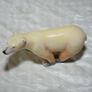 Stone sculpture of a white polar bear Image 5