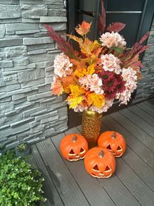 artificial autumn flowers with vase