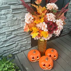 artificial autumn flowers with vase