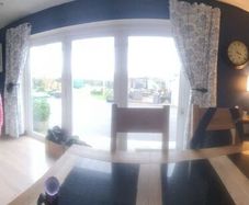 Large white bifold pvc door ,grey wrap on outside
