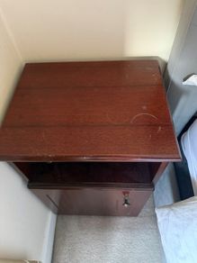 Dark wood bedside lockers with storage cupboard
