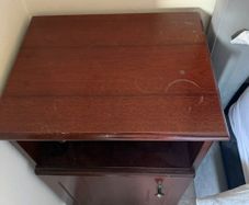 Dark wood bedside lockers with storage cupboard