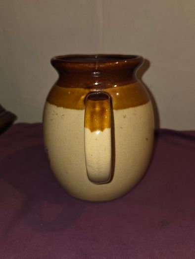 Vintage brown and tan water jug with wheat design