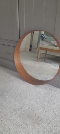 Round mirror with wooden frame