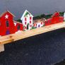 rustic wooden floating shelf display featuring a hand-painted village scene Image 2