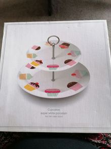 Creative Tops super white porcelain two-tier cake stand featuring a playful pastel cupcake pattern