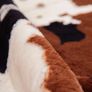 Faux Cowhide Rug (4.6ft x 5.2ft) - Cow Print Area Rug for a Western Boho Decor - Synthetic, Cruelty-Free Animal Hide Carpet with No-Slip Backing Image 4