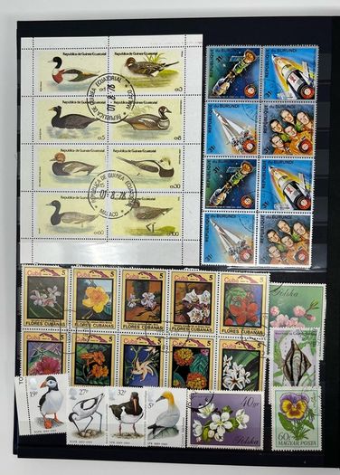 Ace Black 32 page/ 16 leaf Stamp Album with over 900 stamps. Thematic of Animals, Plants, Classic Cars, Space, Trains, Sport & Disney noted.