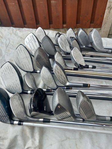 A selection of golf clubs and bags. NOT SELLING SEPARATE