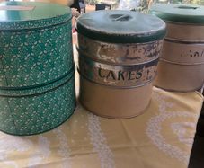 selection of vintage cake storage tins with lids