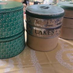 selection of vintage cake storage tins with lids