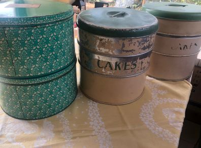 selection of vintage cake storage tins with lids