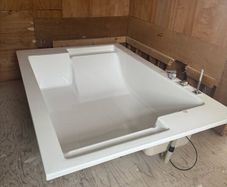 Brand new two person bath with fittings