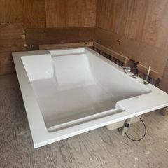 Brand new two person bath with fittings