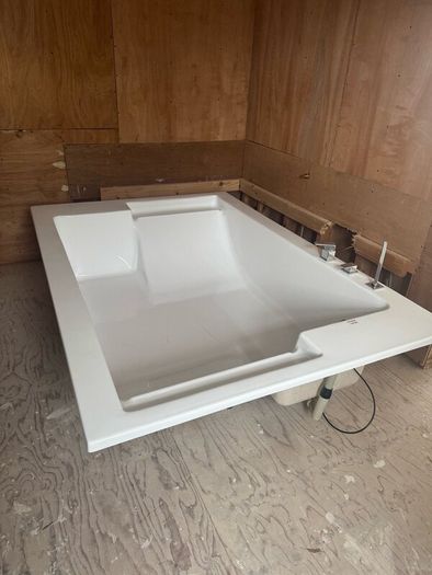 Brand new two person bath with fittings