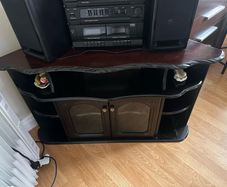 Traditional dark wood corner TV/display unit in good used condition.